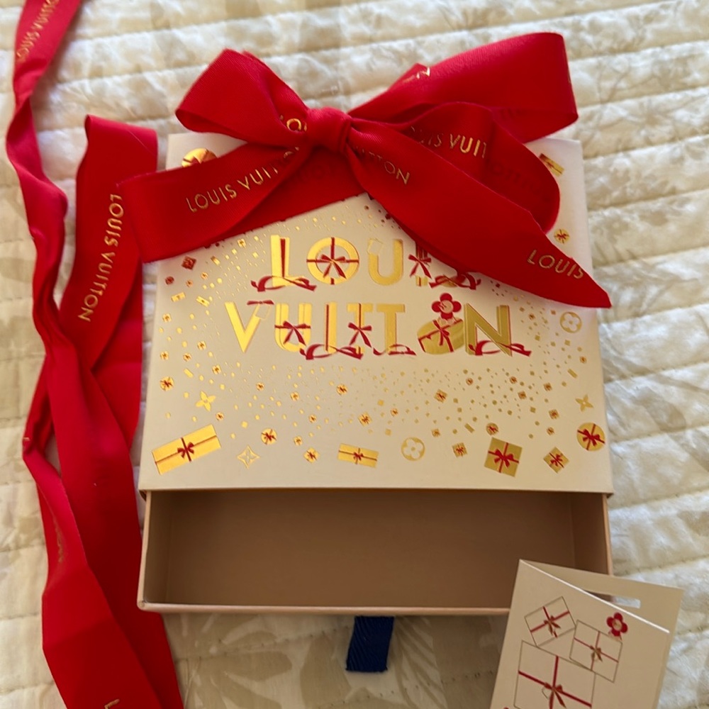 Louis Vuitton gift box with red ribbon and gift tag